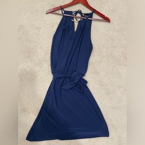 White House Black Market halter cocktail dress with gold neck detail.